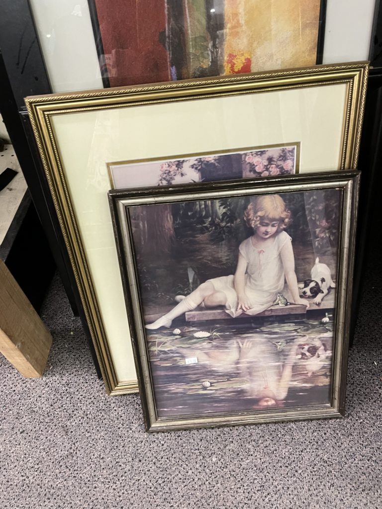 Painting of girl sitting next to dog and looking at reflection