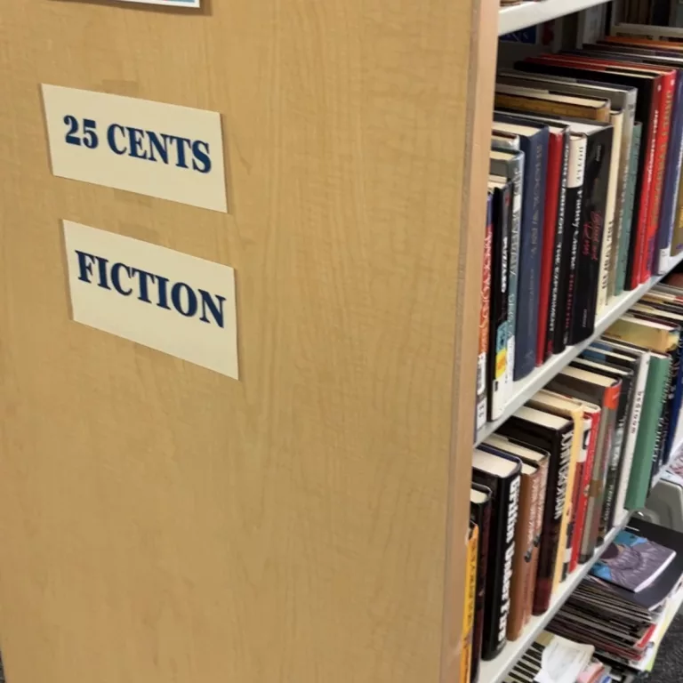 25 cents fiction sign on shelf