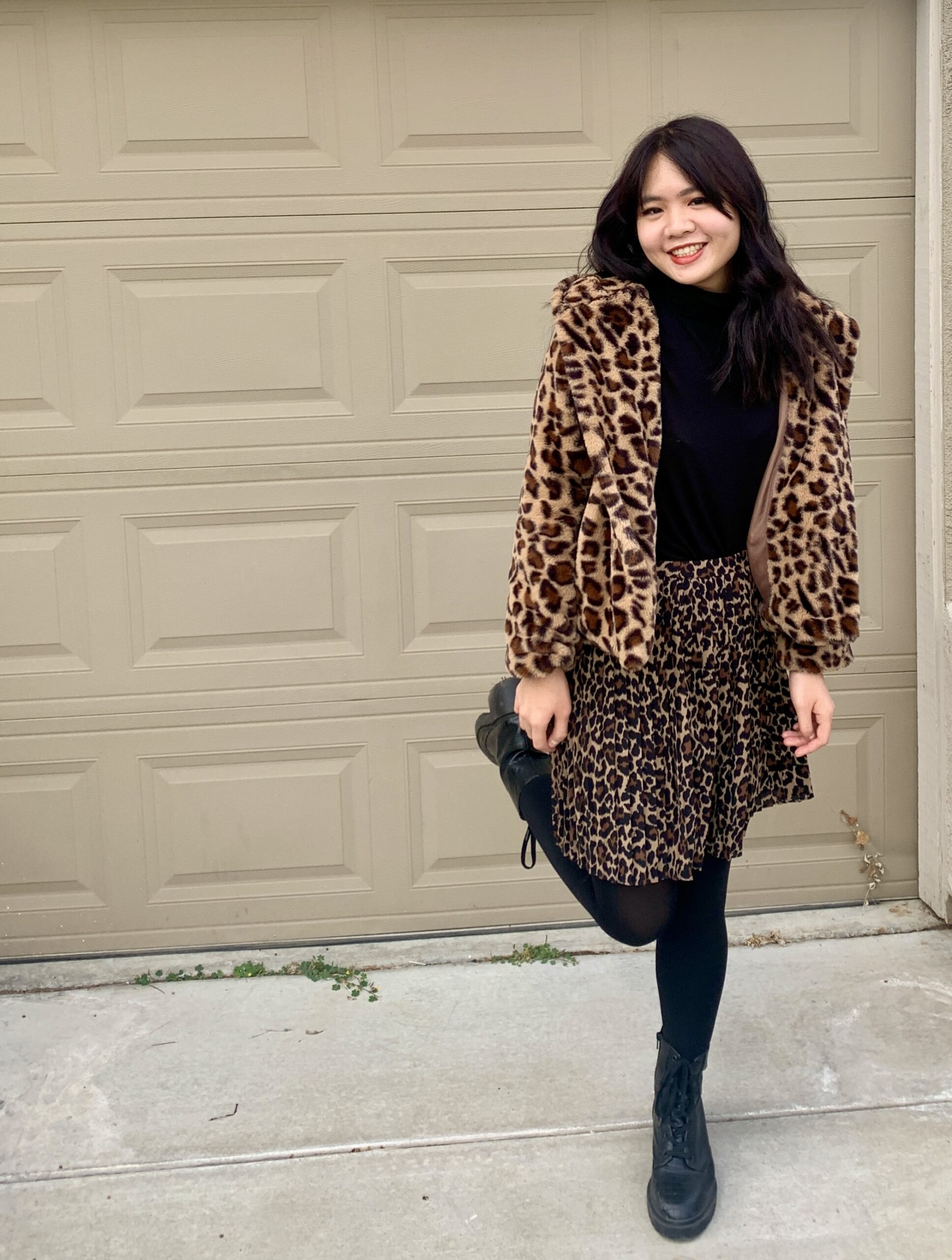 Lady in animal print coat and skirt
