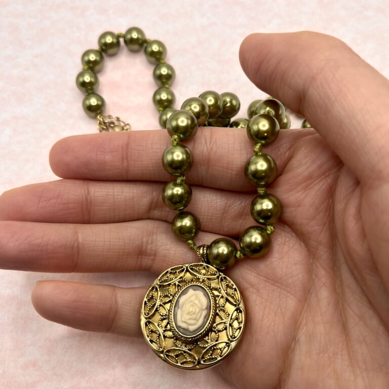 Locket necklace in hand